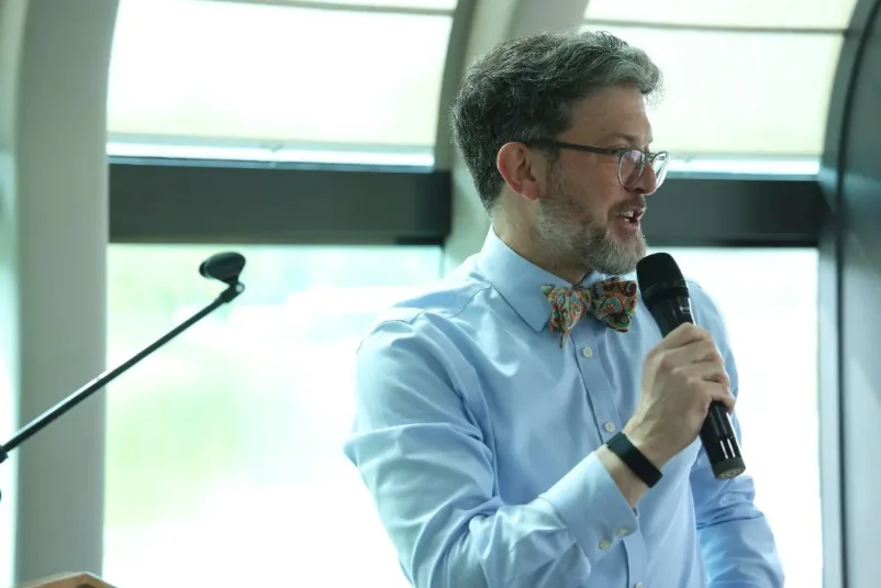 Michael Bachman of Boomi addressing guests onboard