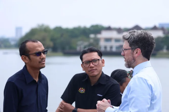 Conversations on the open deck at Putrajaya Lake