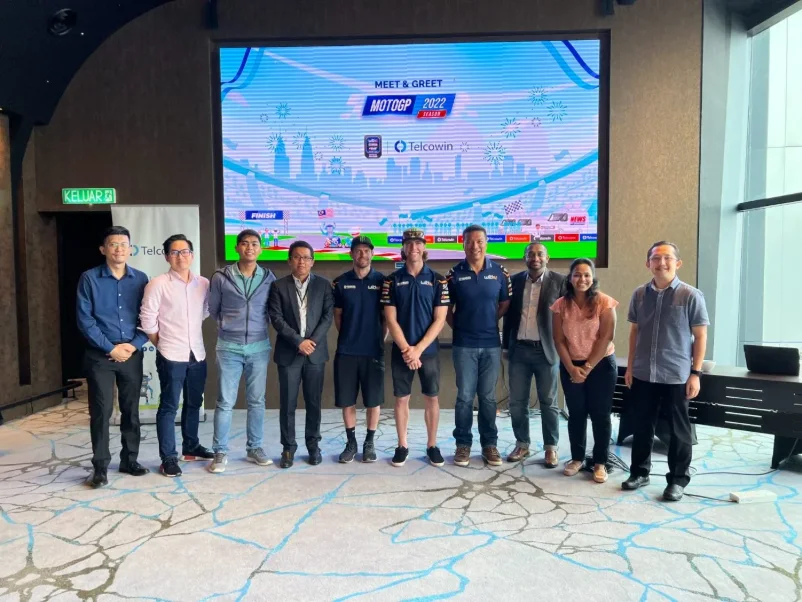 A group of guests photographed with the team