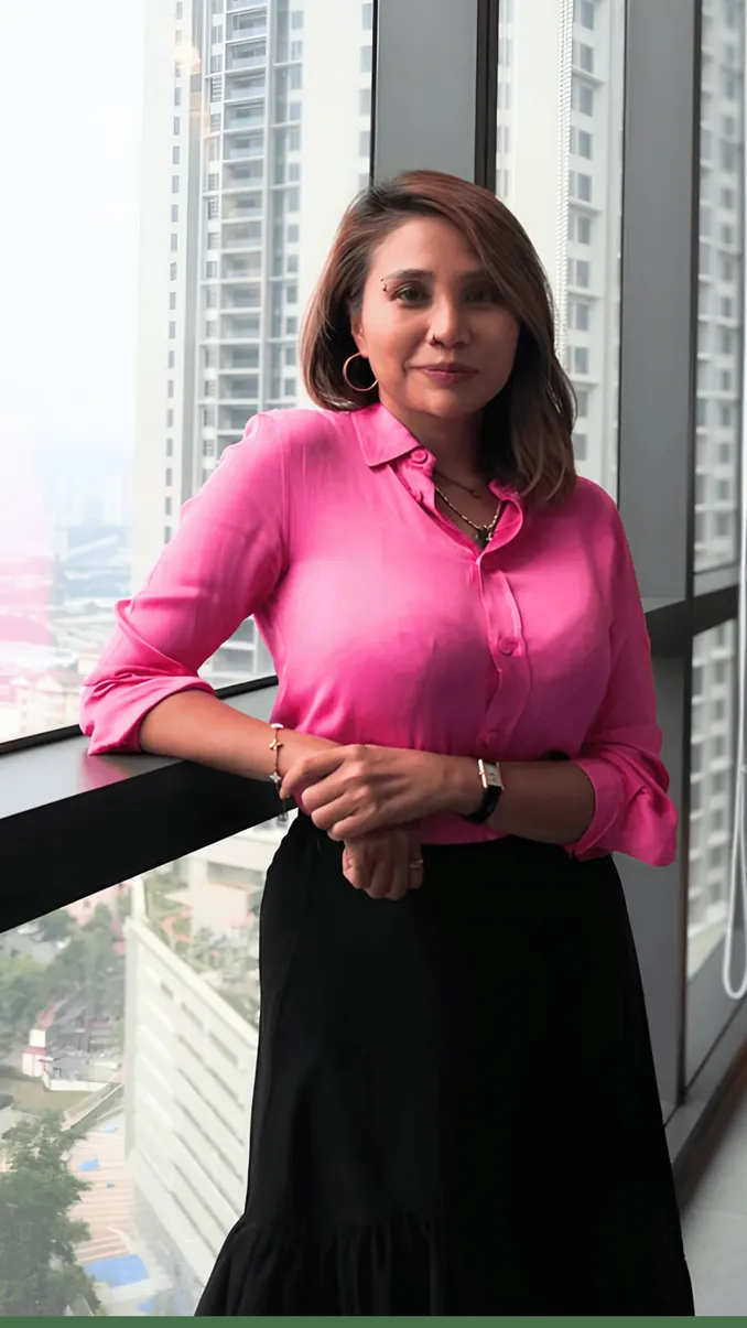 Telcowin team member by the office window