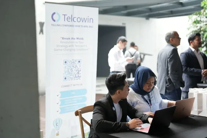 Guests registering at the Telcowin welcome desk