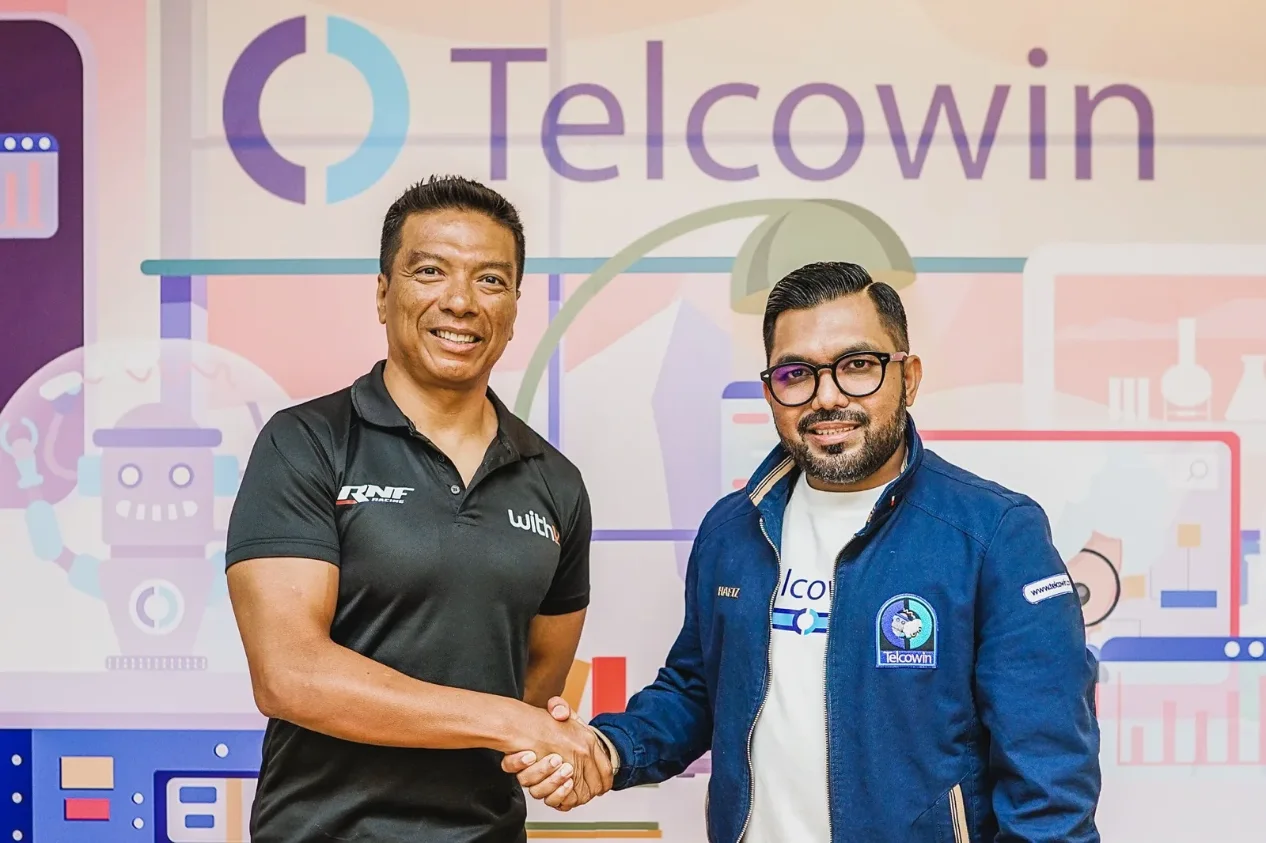 Telcowin team discussing the partnership in the office